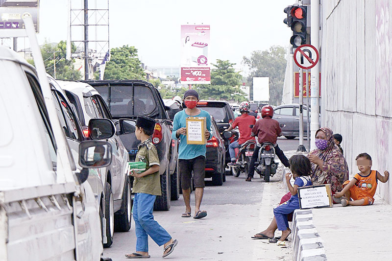 Dinsos Pekanbaru Imbau Pengguna Jalan Tak Beri Sumbangan di Lampu Merah